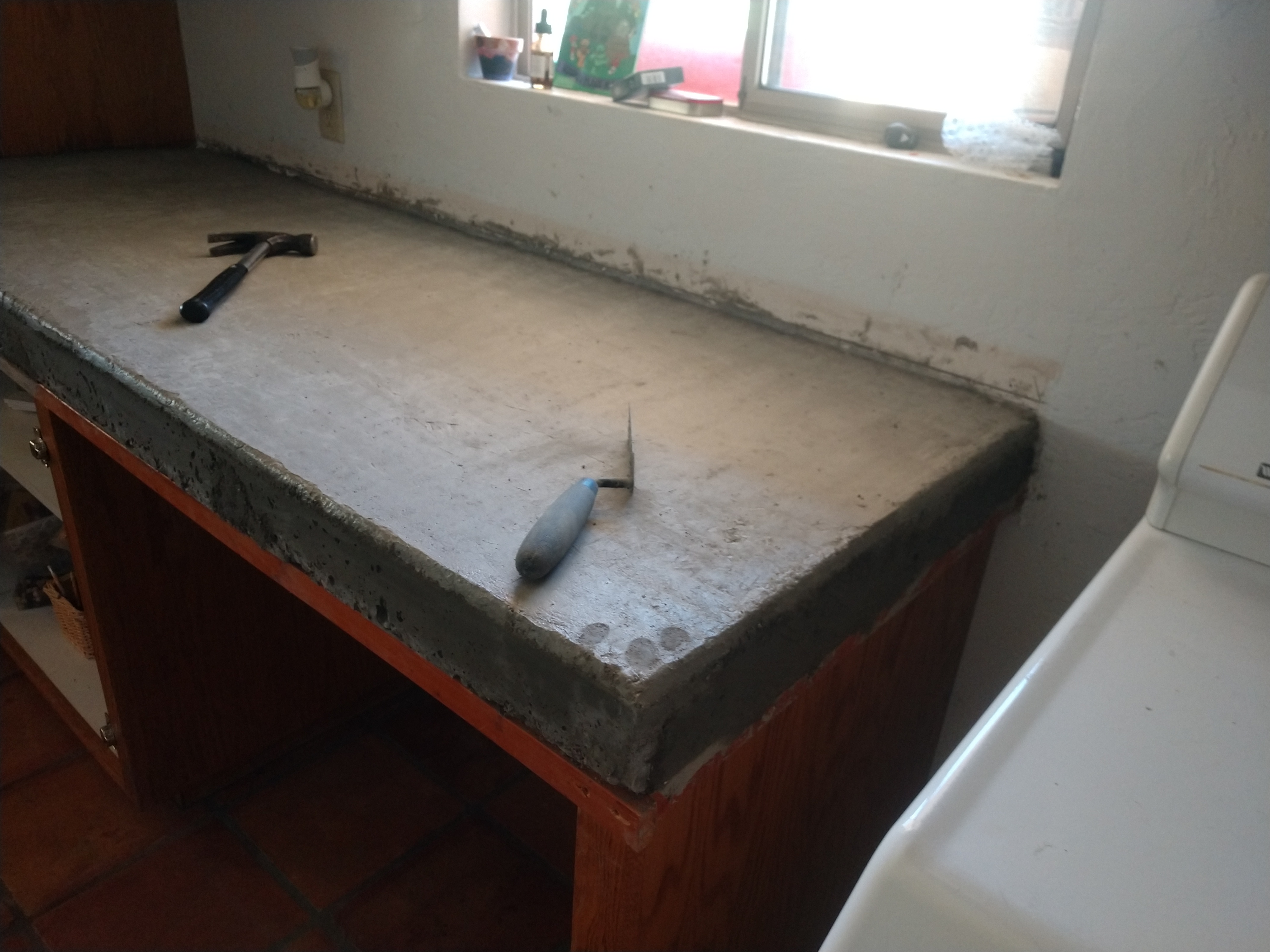 Concrete countertop with protective wrapping during tile work