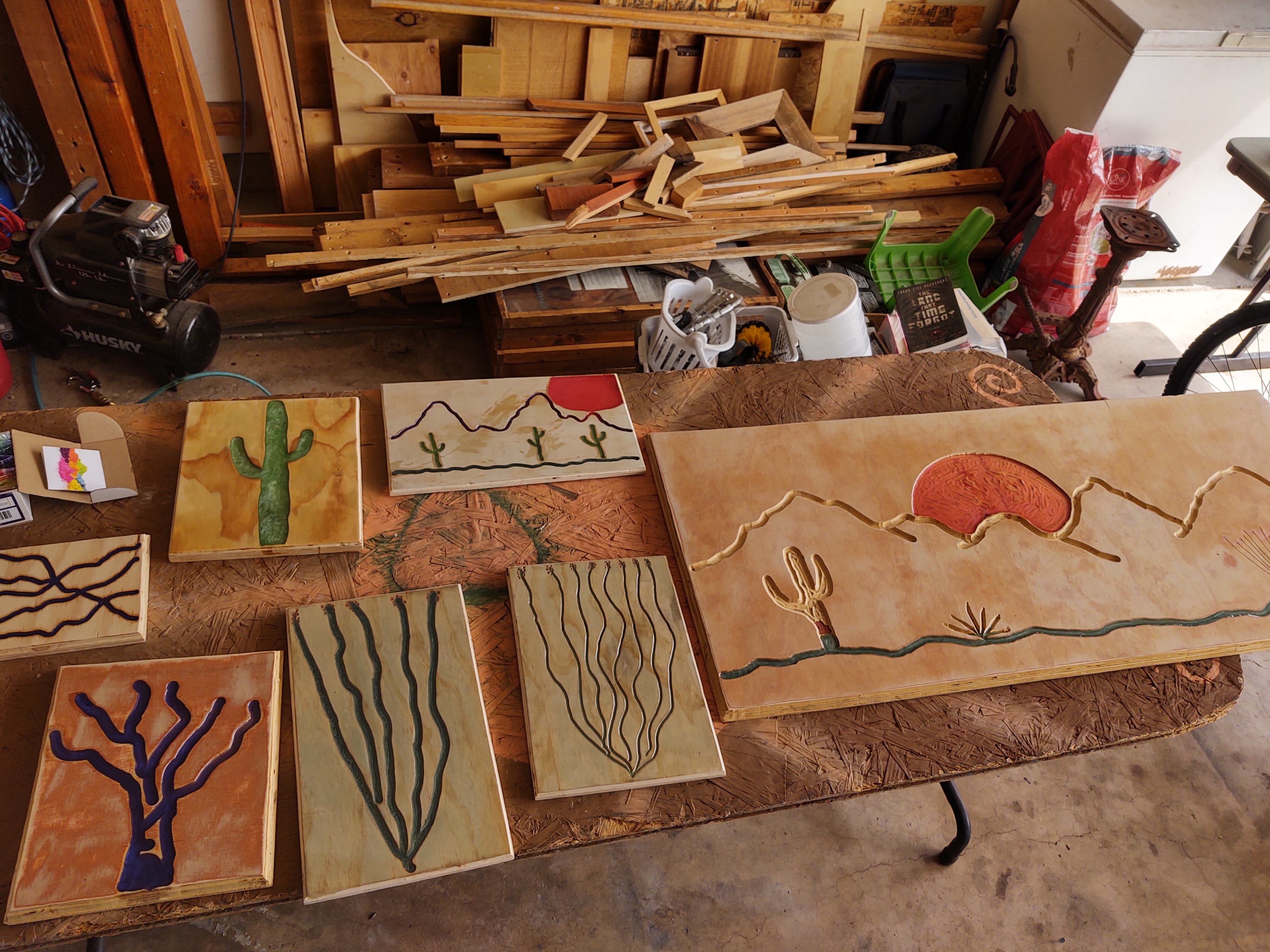 Collection of custom desert-themed wood relief carvings